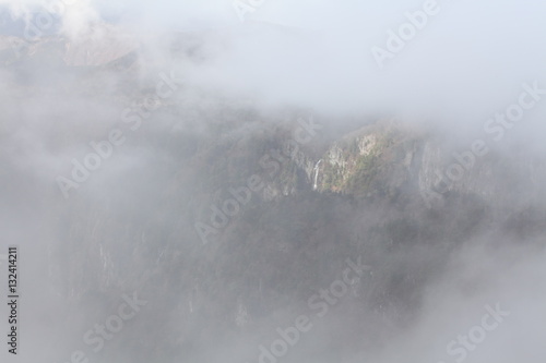 靄がかかる中の滝 奈良県