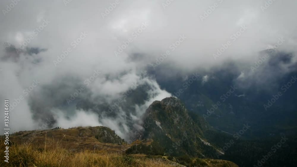 Clouds rising up the mountains, colorful autumn landscape Clouds rising up the mountains, colorful autumn landscape