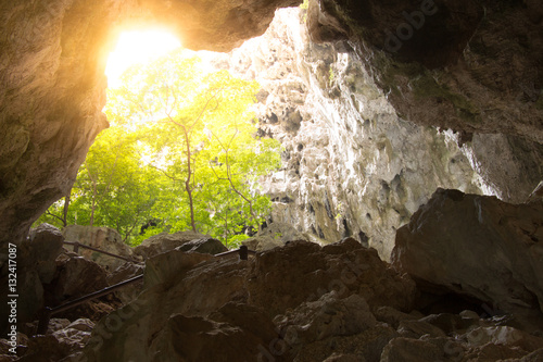 A glimmer of hope as rays of light stream into the cave from the photo