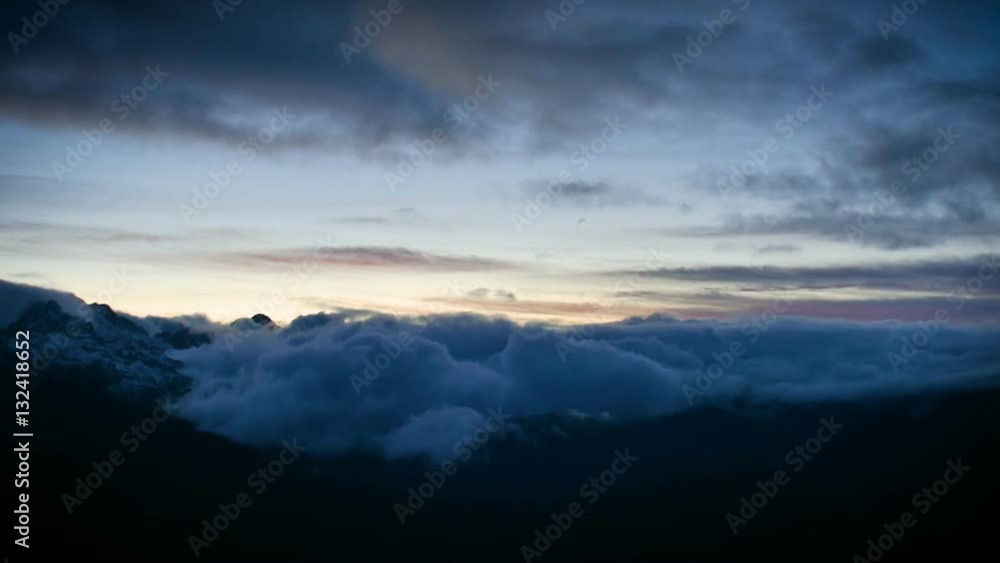 timelapse of winter sunset in high snowy mountains with clouds timelapse of winter sunset in high snowy mountains with clouds
