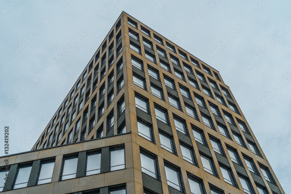 darken skyscraper on cloudy day