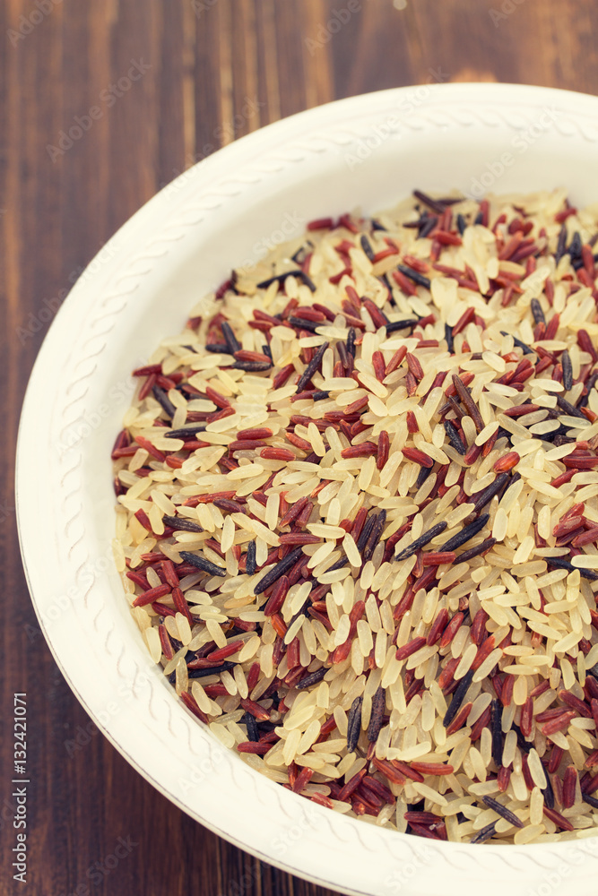 rice in white plate on wooden background rice in white plate on wooden background