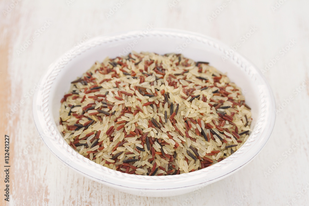 rice in white plate on wooden background rice in white plate on wooden background