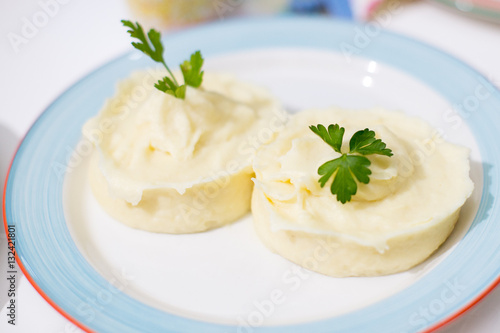 Mashed potatoes on plate.