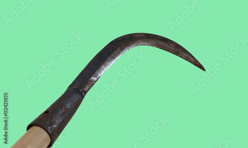 Sickle isolated on a green background. (with clipping path)