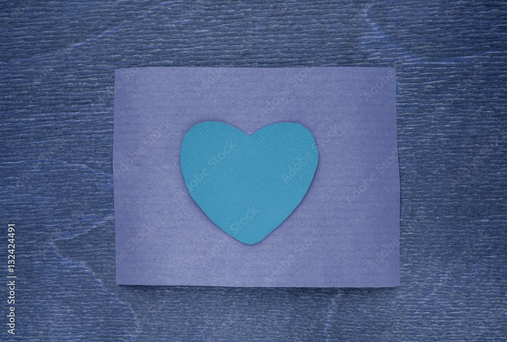 blue craft paper on wooden background blue craft paper on wooden background