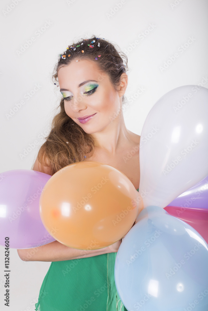 Brunette Woman Holding Balloons on her Birthday Party and Smiling Brunette Woman Holding Balloons on her Birthday Party and Smiling