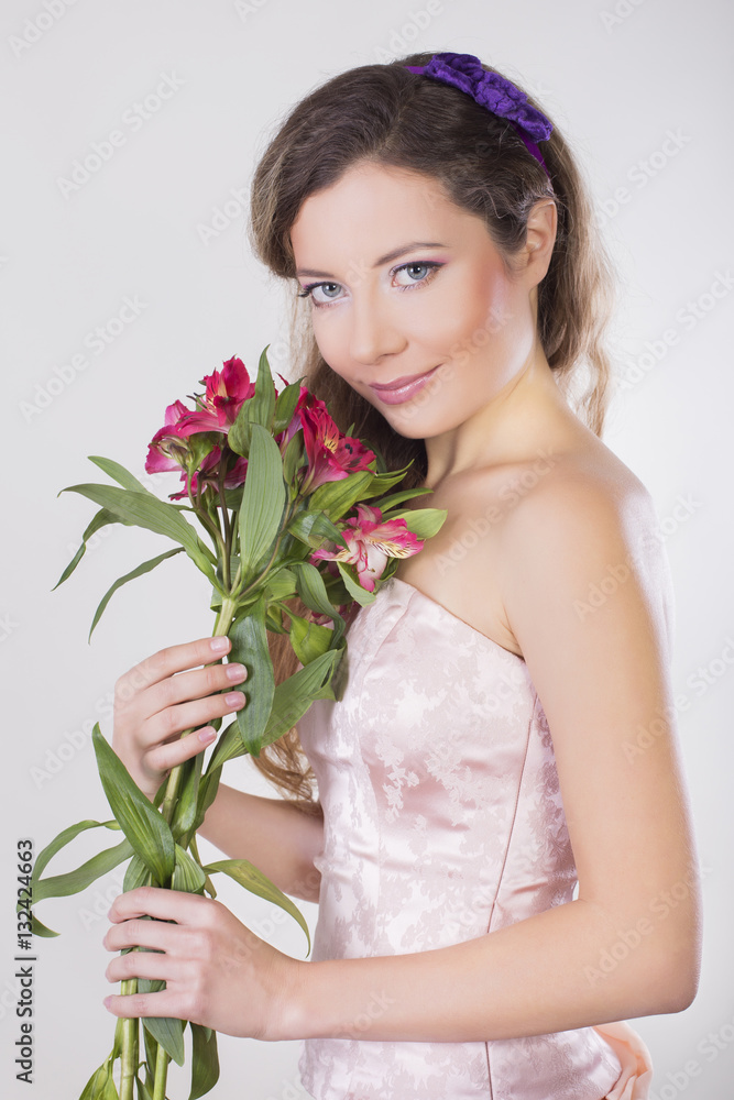 Beautiful happy girl give a wild orchid violet flowers Beautiful happy girl give a wild orchid violet flowers
