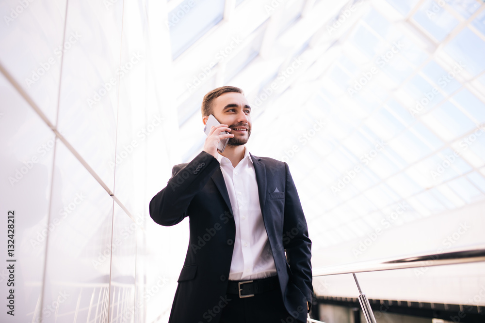 Business man talk on phone in big office and make a dicides Business man talk on phone in big office and make a dicides