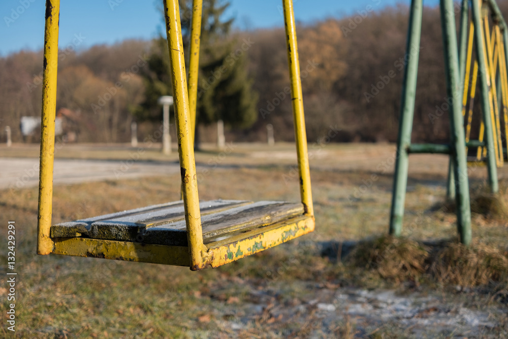 Fototapeta premium Abandoned yellow swing