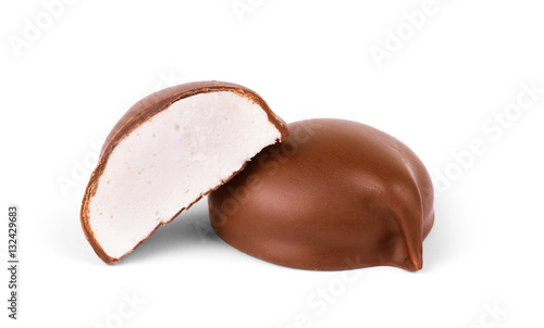 two chocolate covered marshmallows, part of one bitten off, isol