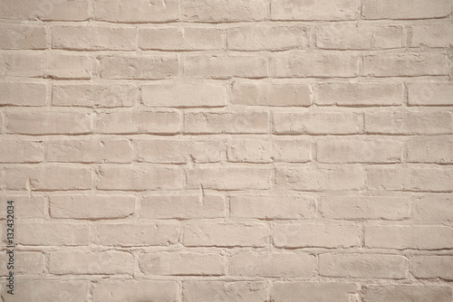 Beige grunge brick wall texture background