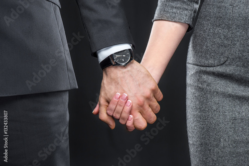 Man and woman holding hands