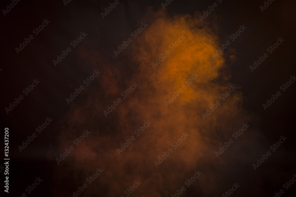 Orange  smoke in a dark room. Texture, background 