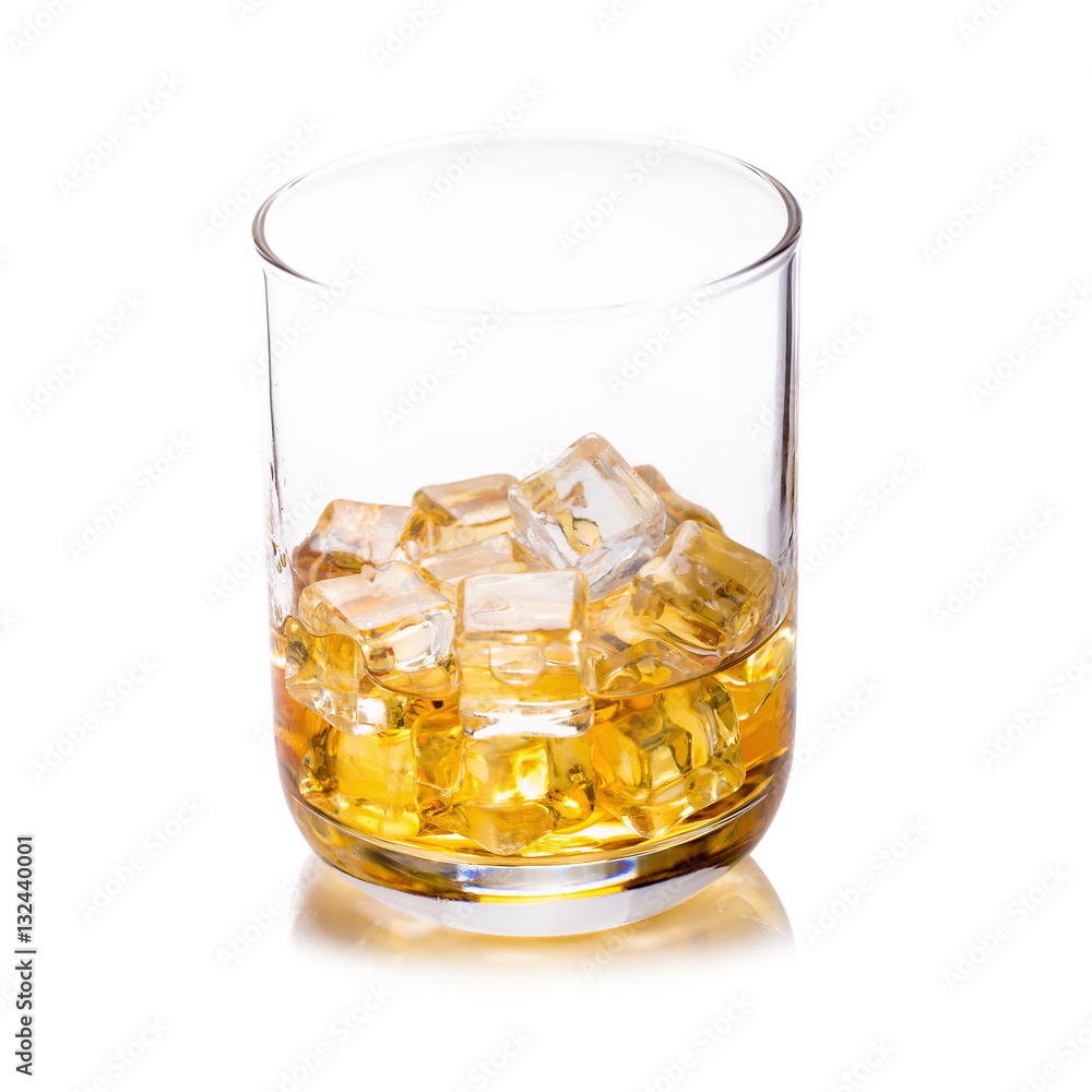 Glass of scotch whiskey and ice on a white background.