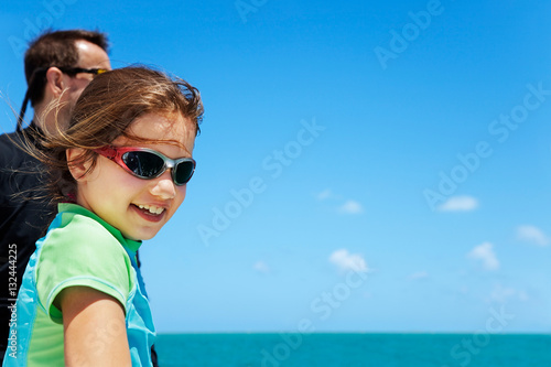 Young girl on a boat with her father