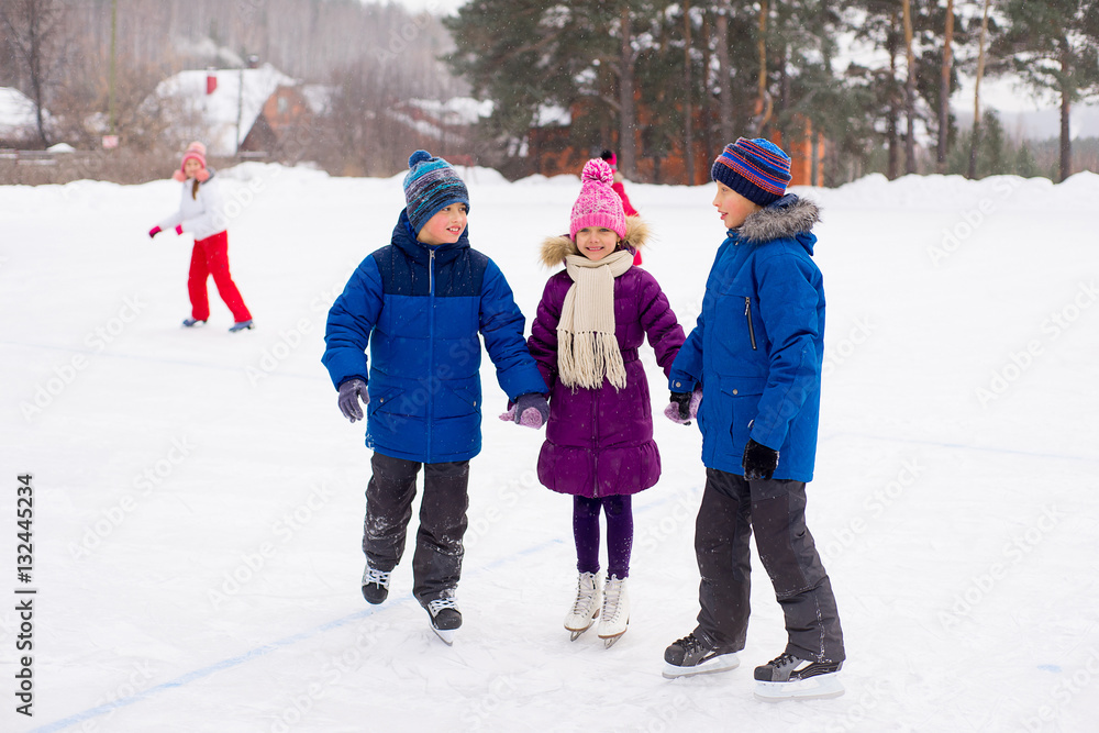 two boys helps girl learn to skate two boys helps girl learn to skate
