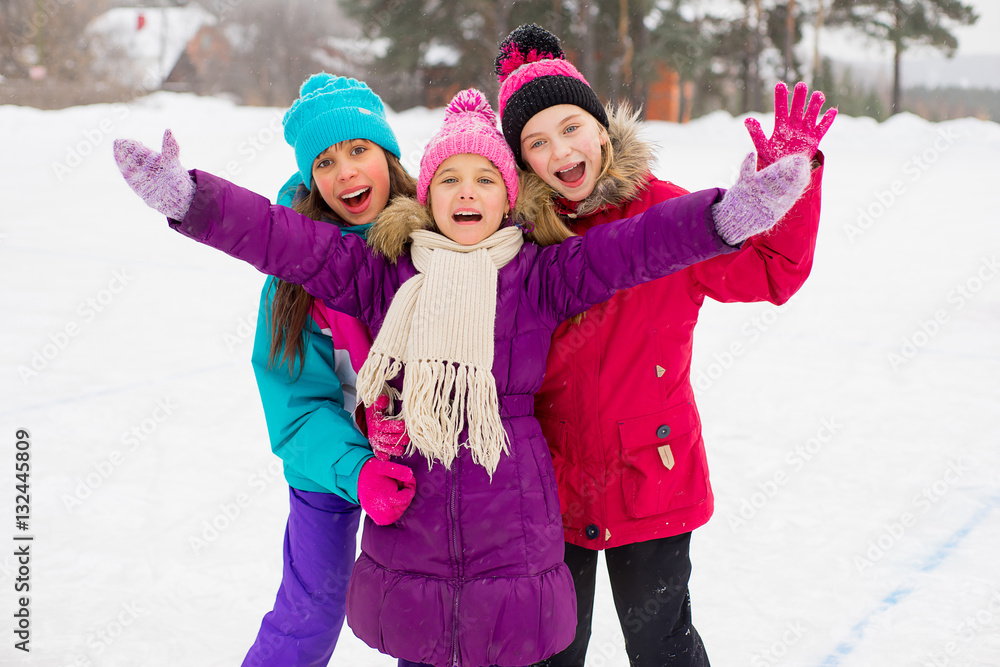 three attractive skater girl hug on the ice