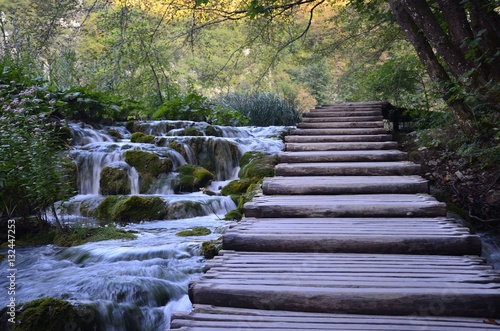 Stairs over watterfall photo