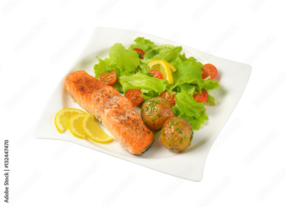 salmon fillet with roasted potatoes and fresh vegetables salmon fillet with roasted potatoes and fresh vegetables