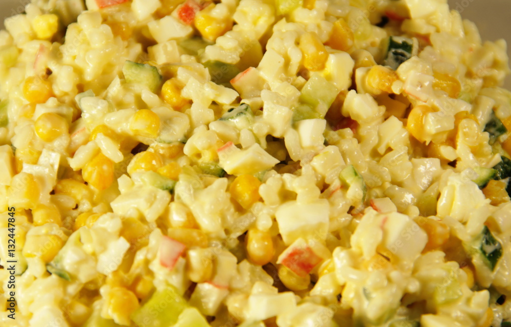 Salad with crab sticks, corn, cucumber, eggs and rice Salad with crab sticks, corn, cucumber, eggs and rice