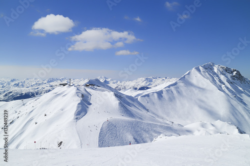 Ski slopes, chairlift on top of a mountain in French Alps on a clear winter day, Paradiski, Plagne, © Yols