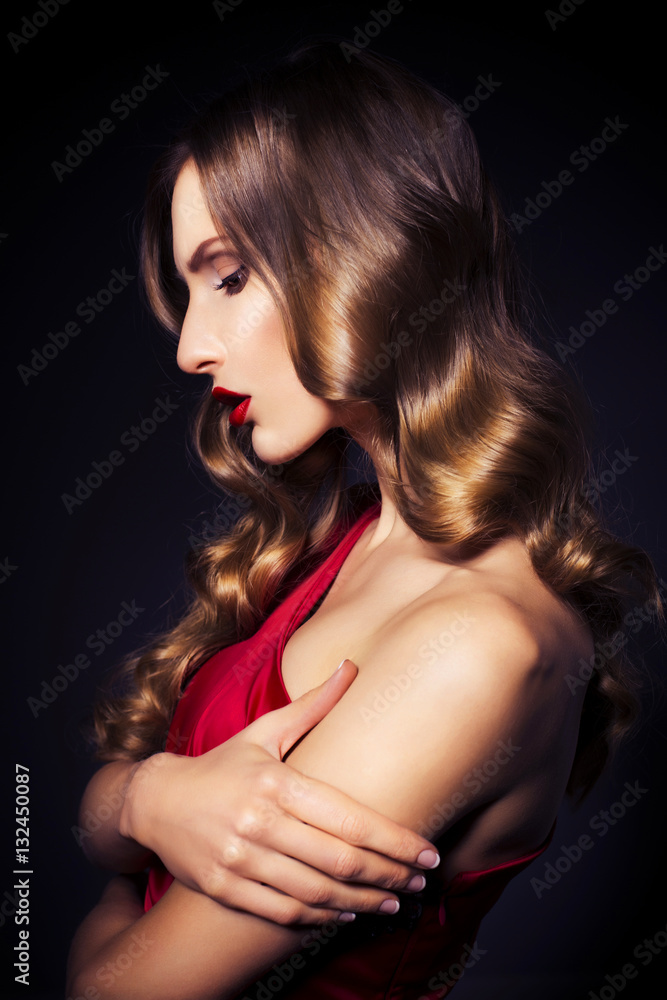 Naklejka premium Brunette beautiful luxury woman in red dress with clear skin and
