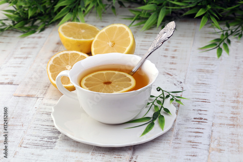 Tea. Herbal tea. Mint leaf. Tea in a glass cup, mint leaves, dried tea, sliced lime. herbs on a slate plate in a restaurant or teahouse 