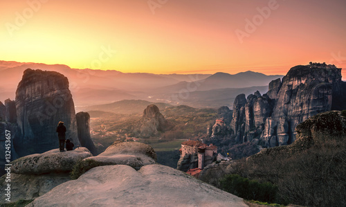 Breathtaking view of Meteora Roussanou Monastery at sunset, Greece. Geological formations of big rocks with Monasteries on top of them.