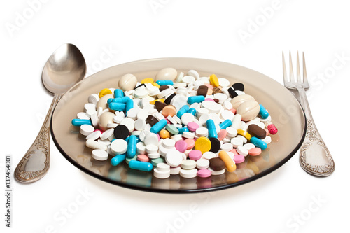 Plate with pills and Cutlery