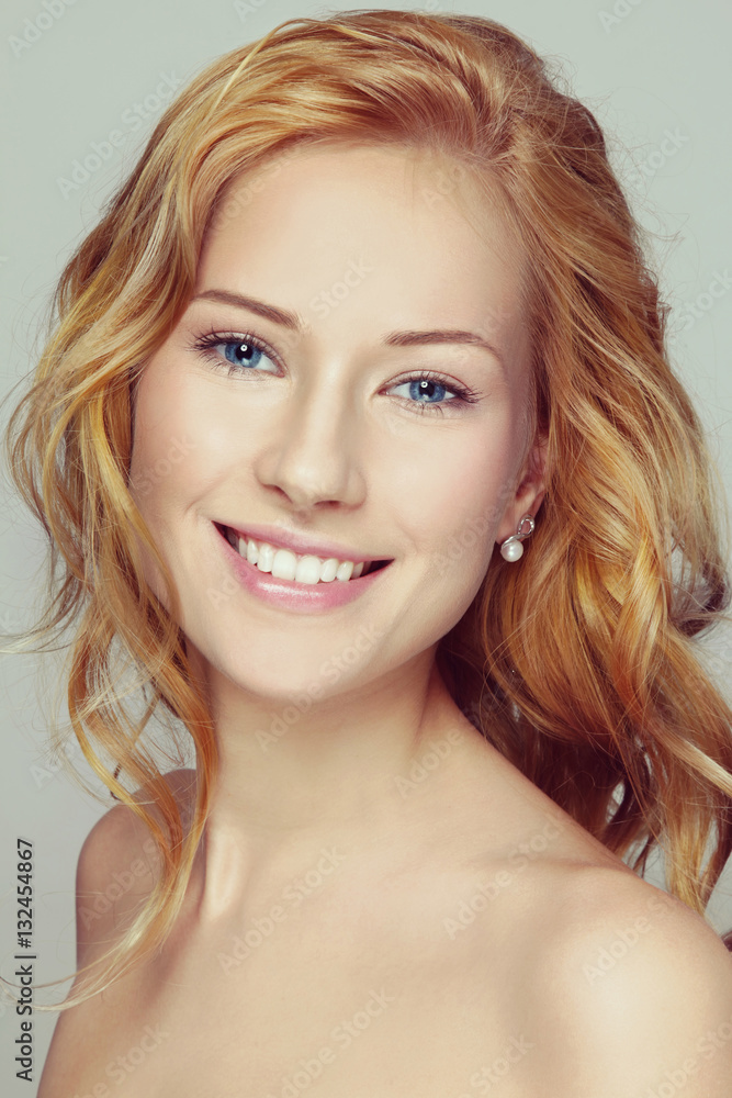 Portrait of young beautiful happy smiling girl with curly red hair and clean make-up Portrait of young beautiful happy smiling girl with curly red hair and clean make-up