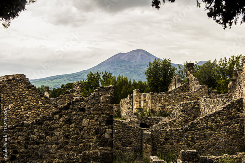 Pompeii city destroyed in 79BC by the eruption of Mount Vesuvius. The antique ruins and the vulcano near Naples, Italy photo