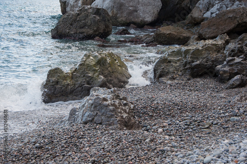 rocks by the sea in a small storm in high quality