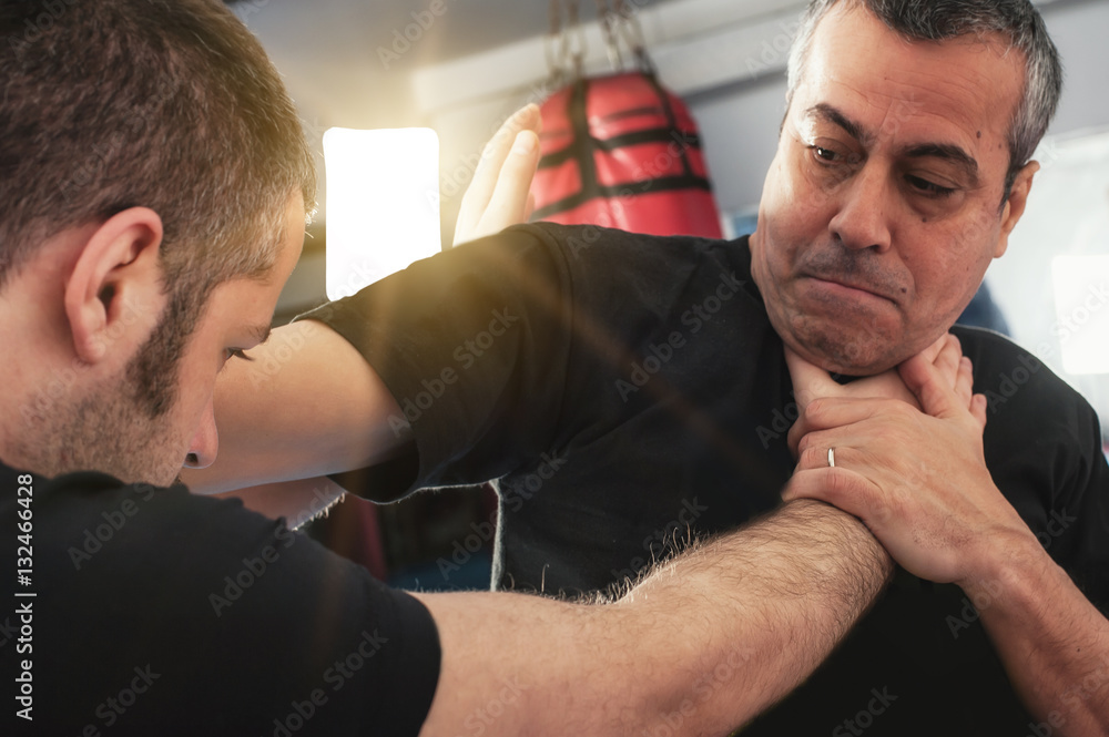 Street fighting self defense technique against holds and grabs Street fighting self defense technique against holds and grabs