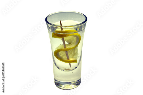 alcoholic drink in a glass with lemon