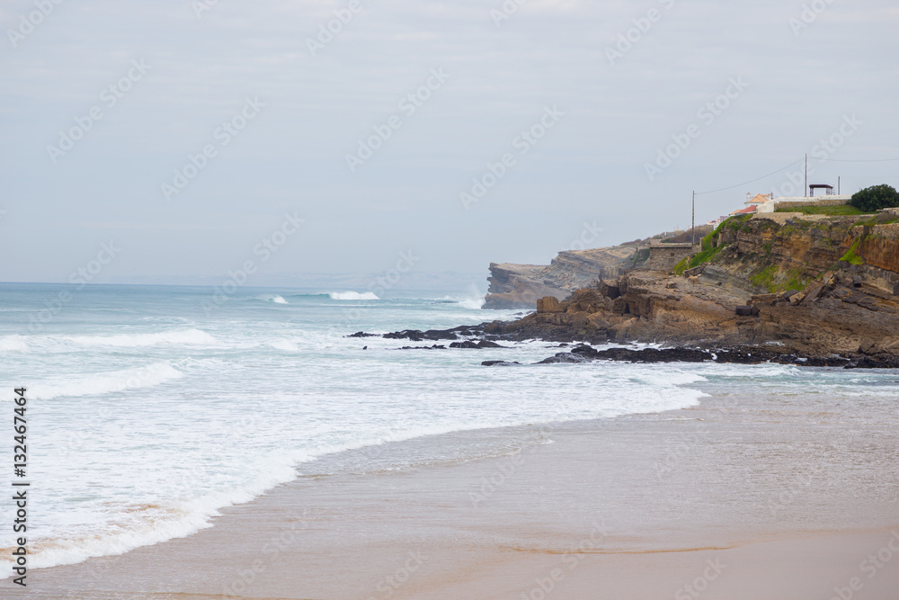 atlantic coastline with surfes in cloudy day