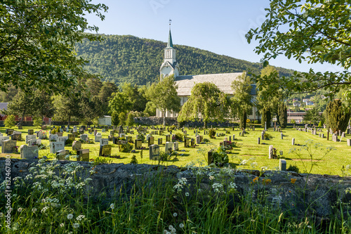 Cemetery and Wooden church of 1873 at Sjøholt, Norway photo
