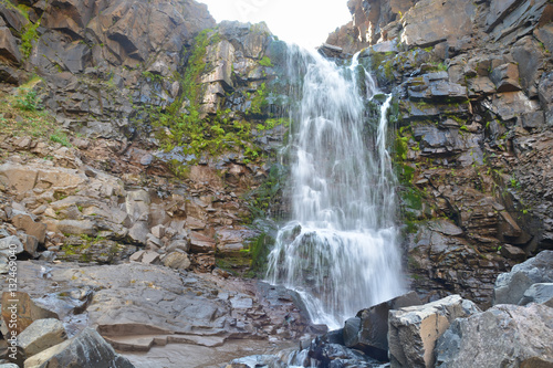 Waterfall among the rocks on the Putorana plateau.
