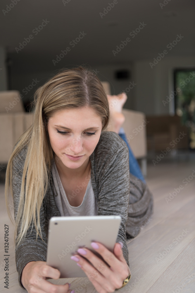 young women used tablet computer on the floor young women used tablet computer on the floor