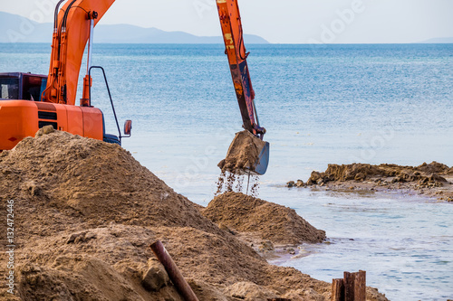 Excavator on the reclamation land.