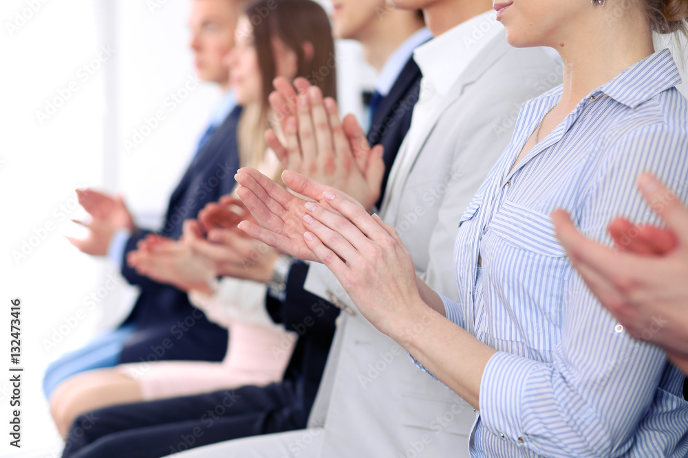 Close up of business people hands  clapping at conference