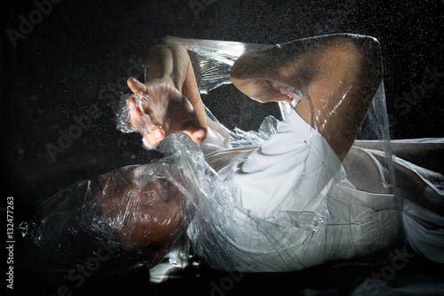 Obraz na płótnie person trapped in plastic sheets w salonie