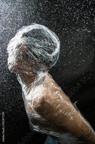 Obraz na płótnie person trapped in plastic sheets w salonie