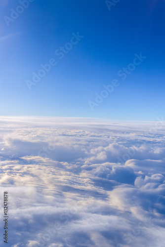 white clouds and blue sky skyscraper. view from the window of an
