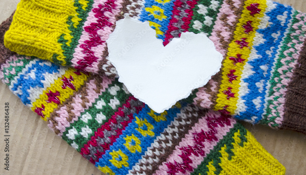 Paper heart with space for text on a colored textile background. Valentine with love