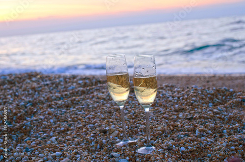 Wineglass on the beach in the evening