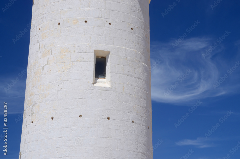 Window of old Paphos lighthouse white wall,blue sky,Cyprus