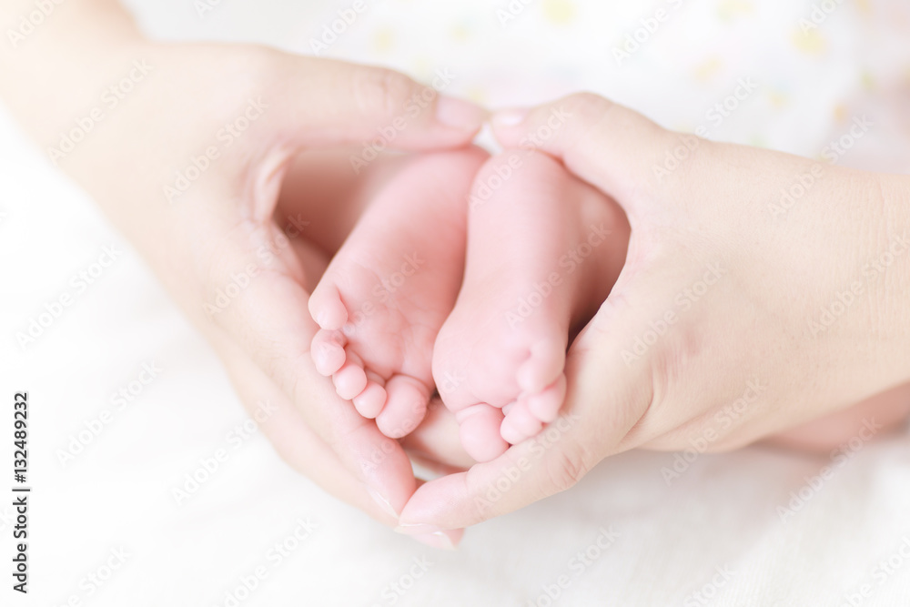 newborn baby feet on mother hands newborn baby feet on mother hands