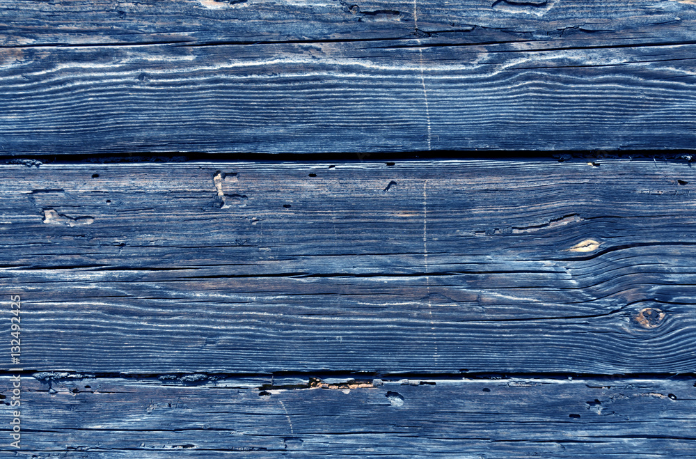 Blue toned weathered log house surface. Blue toned weathered log house surface.