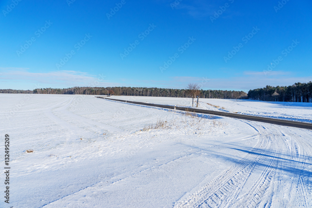 Winding country road in the winter landscape